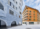 The apartment houses are located at the new Andermatt village square